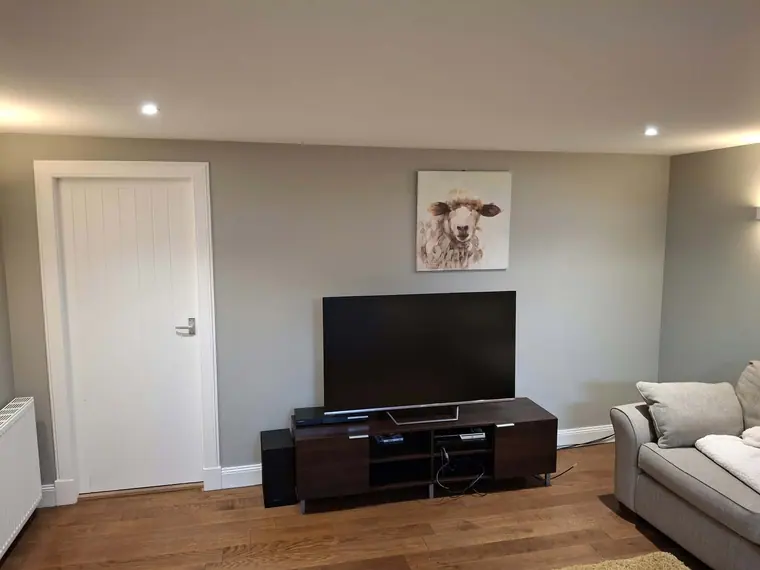 A second room in the same calm grey.